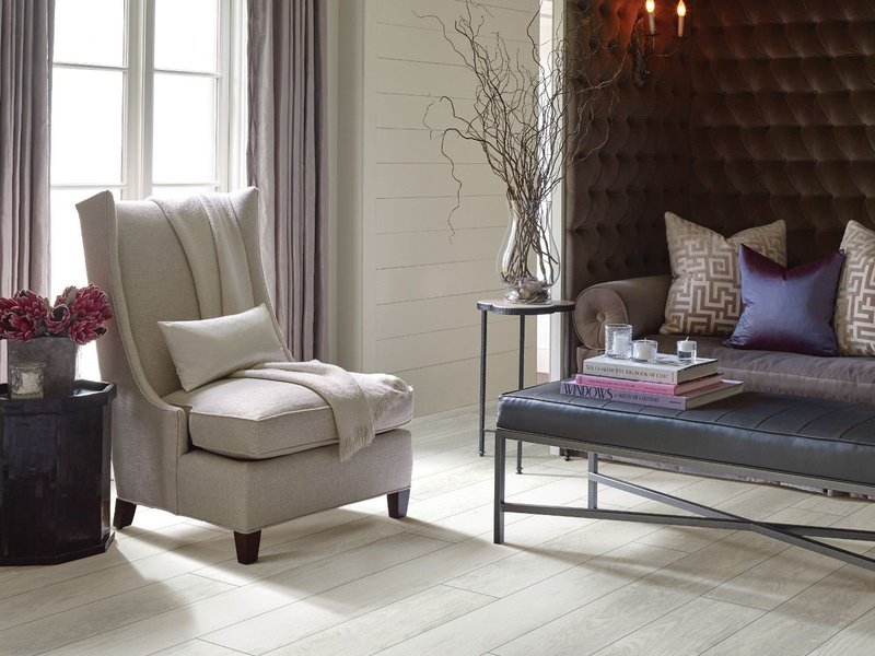 living room with hard flooring and couches - Home Designs of Hastings in Hastings, MN