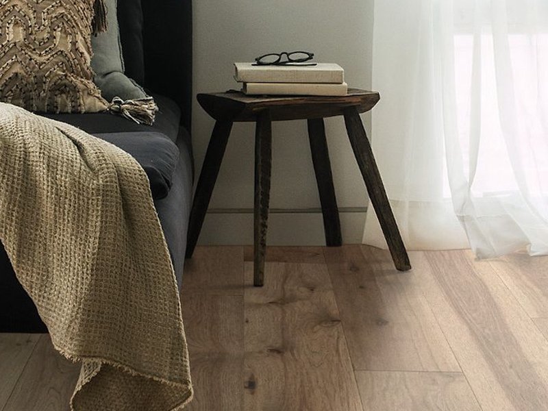 hardwood flooring with small side table - Home Design of Hastings in Hastings, MN