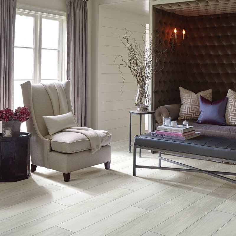 Living room with sofa and armchair - Home Design of Hastings in Hastings, MN